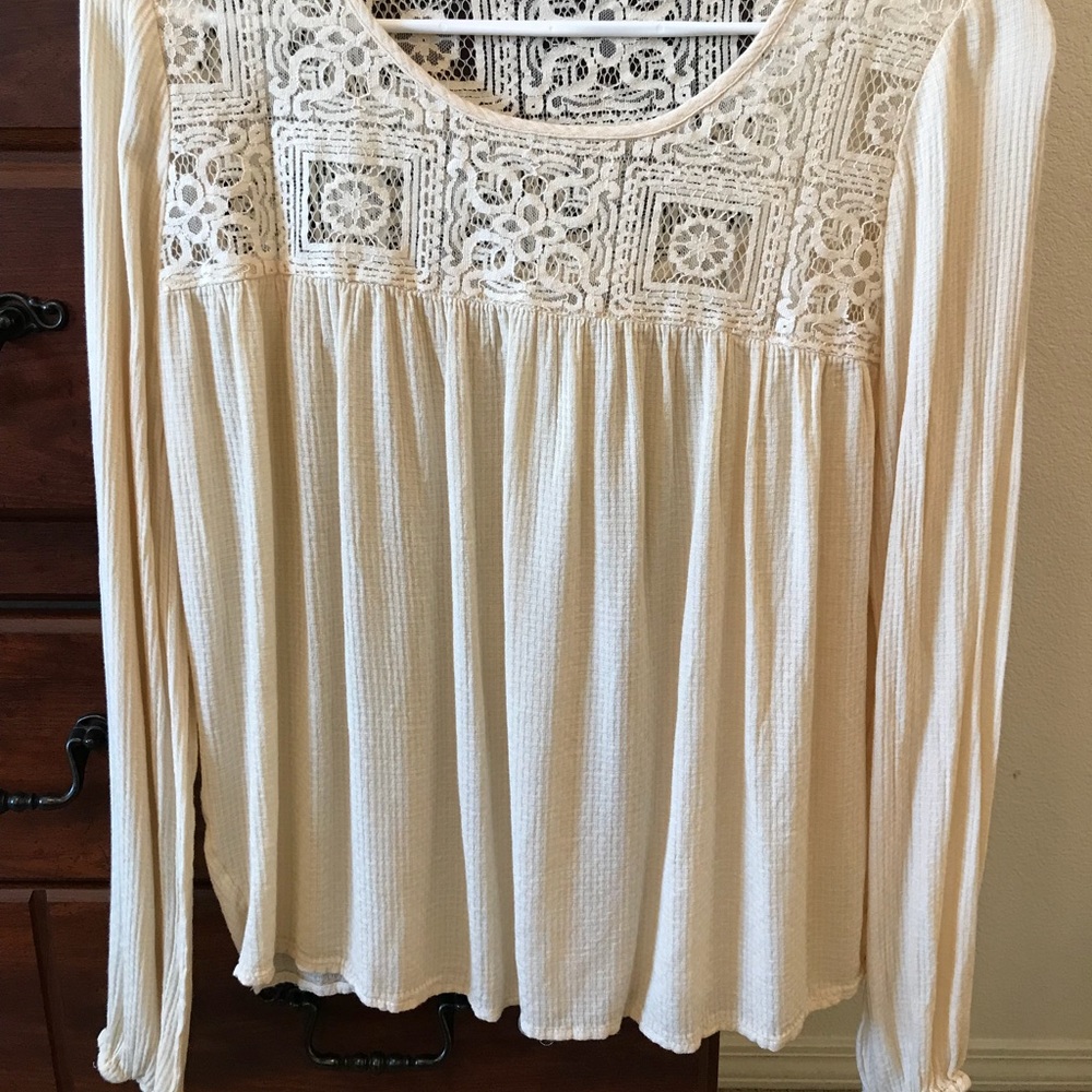 Long sleeve cream dress shirt.